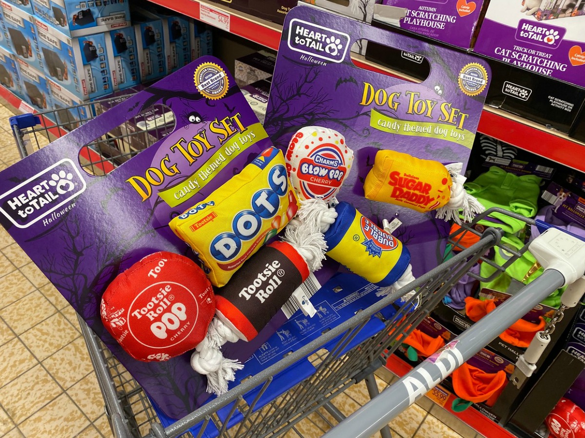 shopping cart with dog toys in it