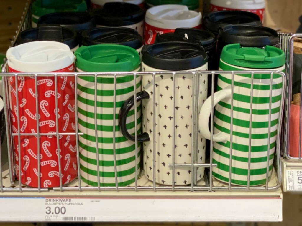 A variety of holiday colored mugs on store shelf at Target