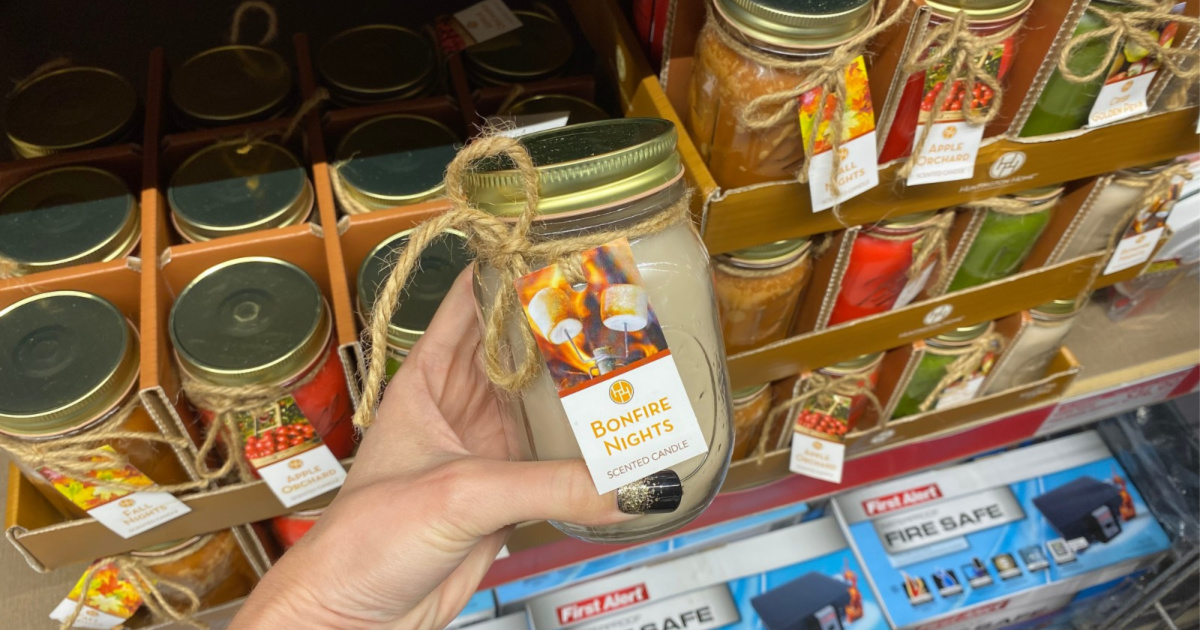 hand holding up mason jar candle at aldi