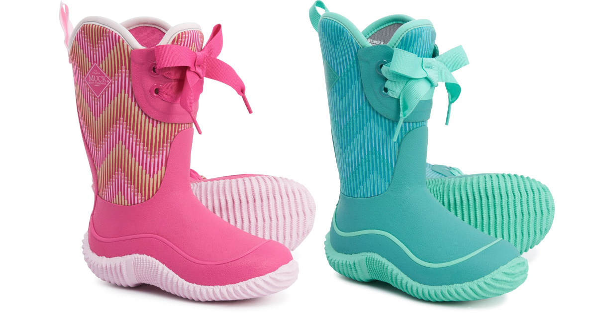 two pairs of kids muck boots in pink and blue