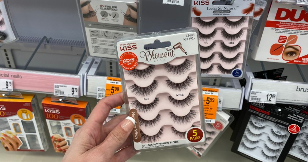 hand holding up kiss lashes at walgreens