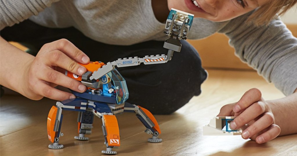 boy playing with lego arctic ice crawler building kit