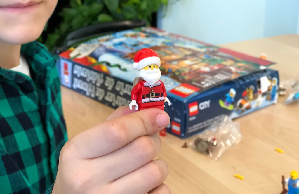 hand holding a lego city santa 