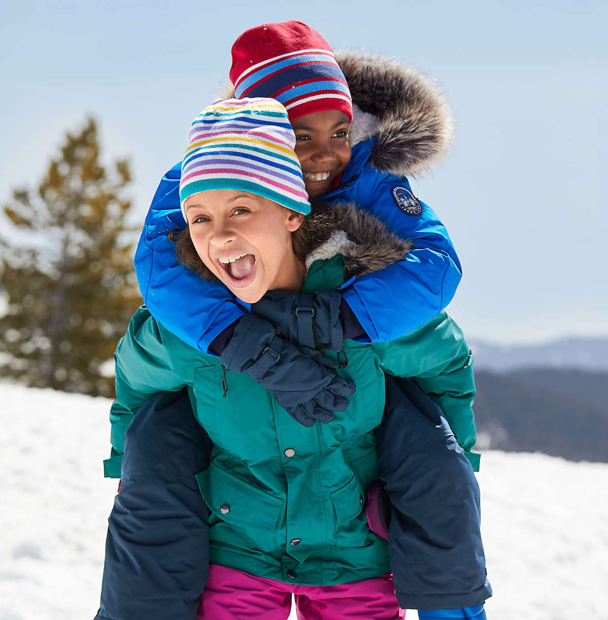 kids wearing colorful best kids winter coats lands end jackets in the snow