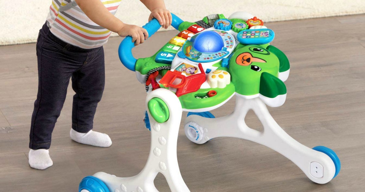child pushing LeapFrog walker