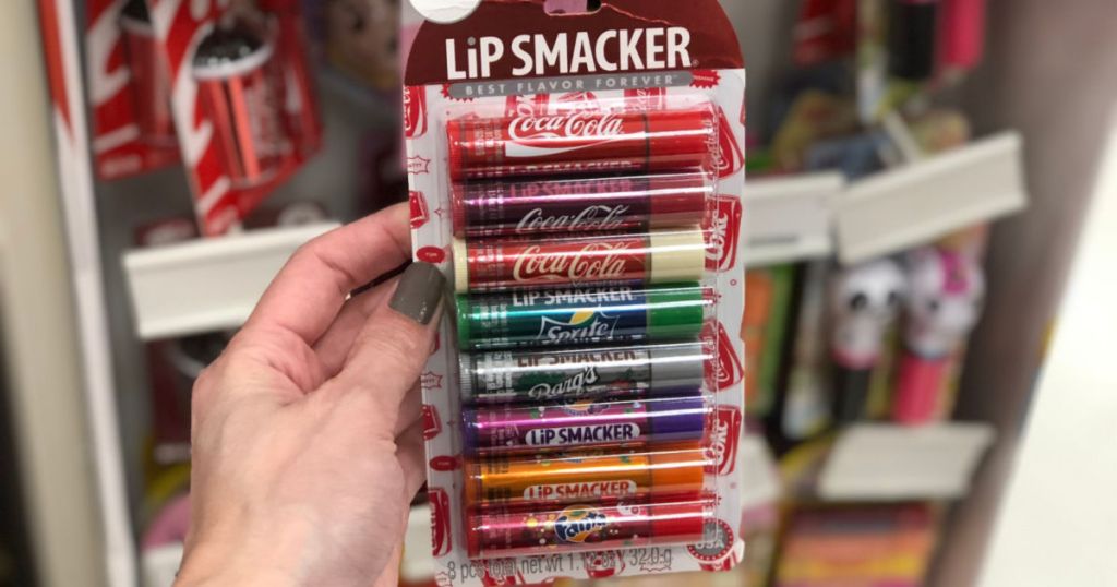 hand holding up lip coca-cola lip smackers set