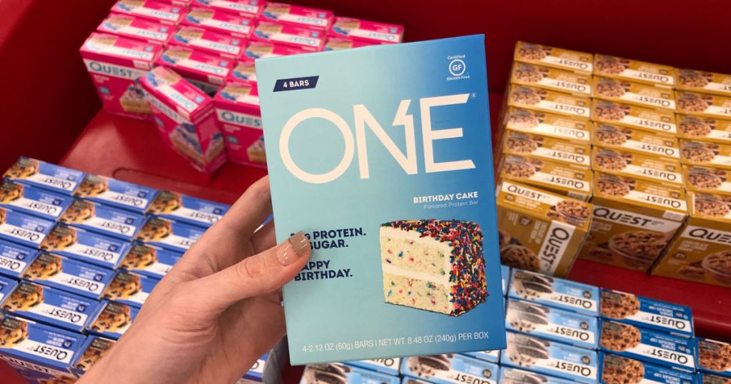 hand holding up box of one birthday cake bars