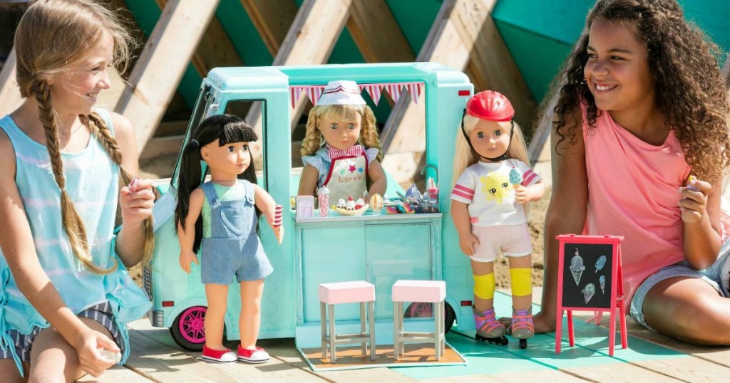 girls playing with Our Generation Sweet Stop Ice Cream Truck and accessories