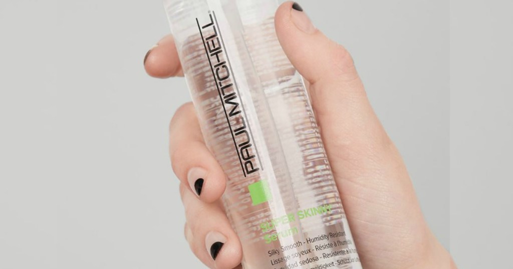 hand holding Paul Mitchell Serum