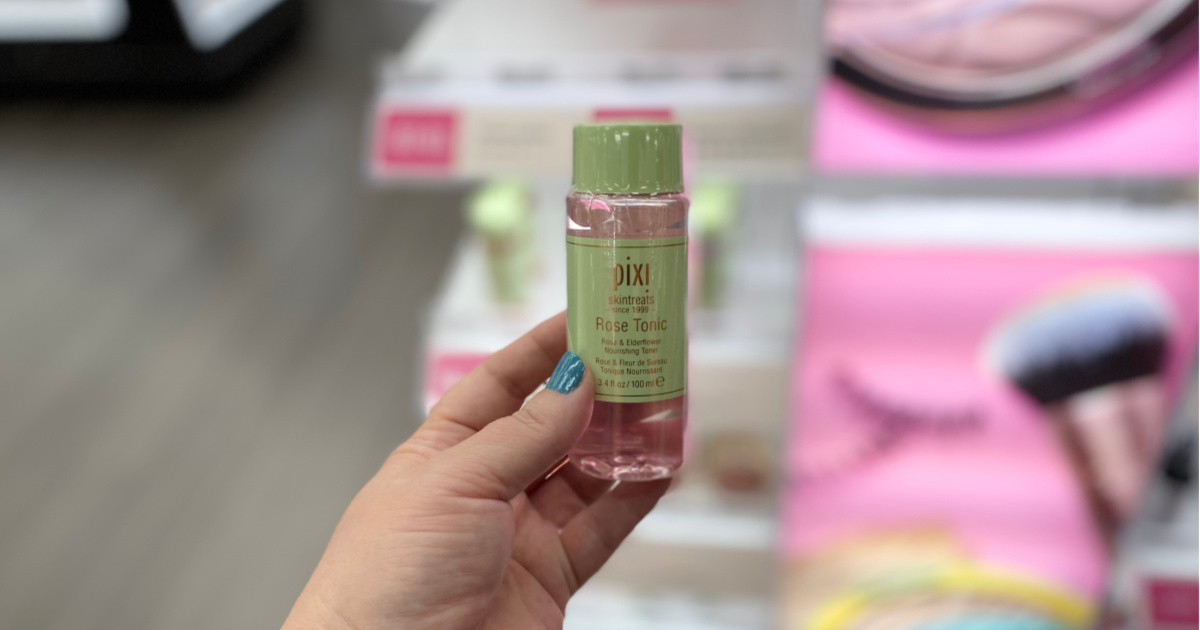 hand holding up pixi skintreats tonic