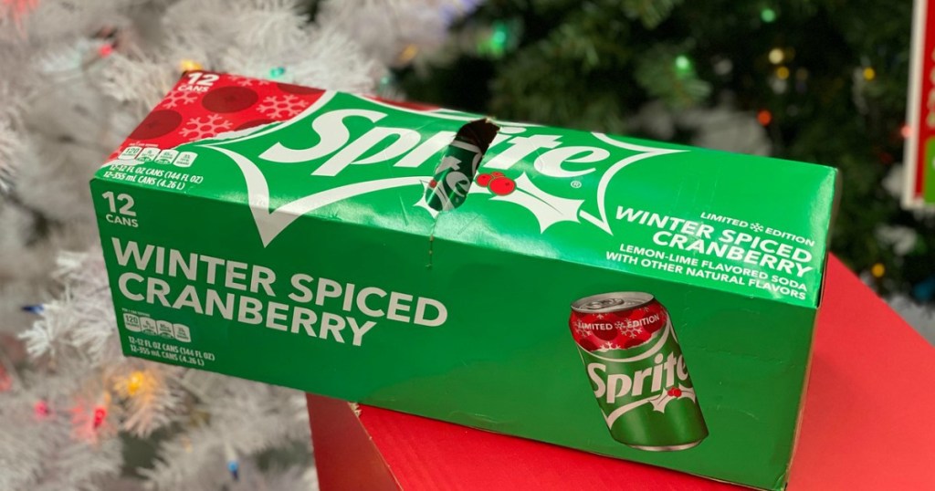 Sprite Winter Spiced Cranberry 12-pack cans near Christmas tree