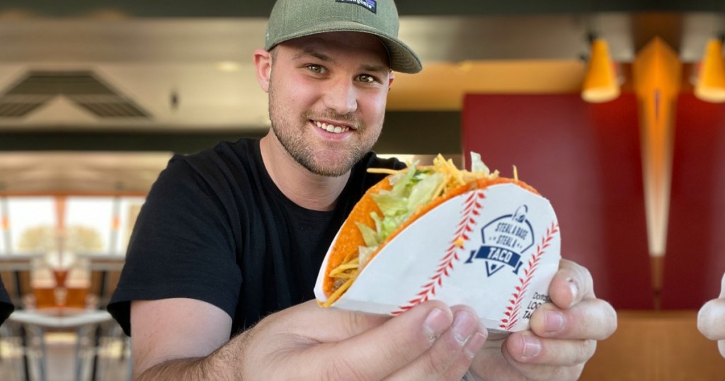 Man holding Taco Bell taco