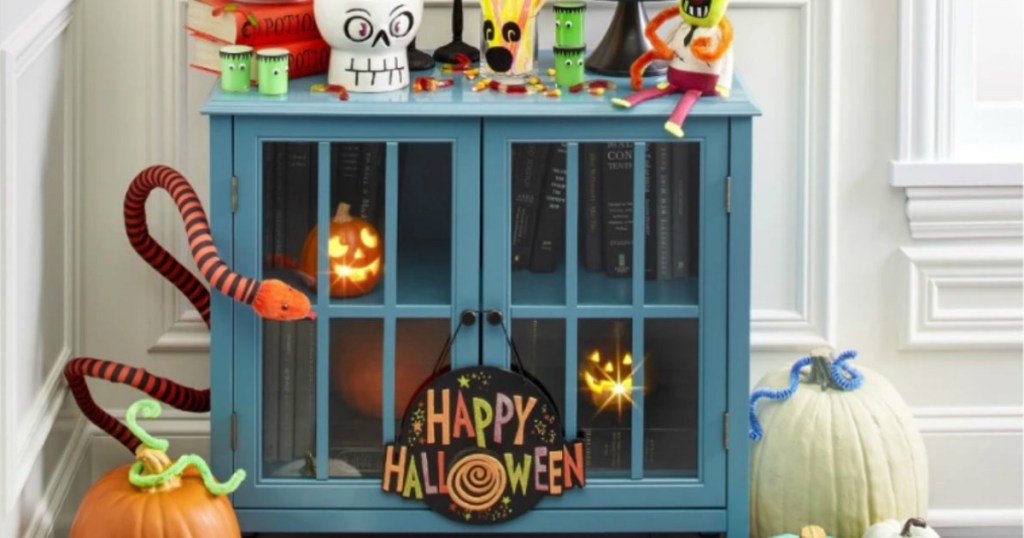 Teal Threshold stand with lots of Halloween Decor on it