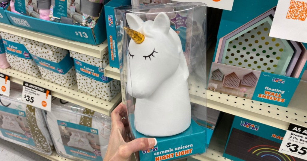 hand holding up ceramic unicorn night light at big lots
