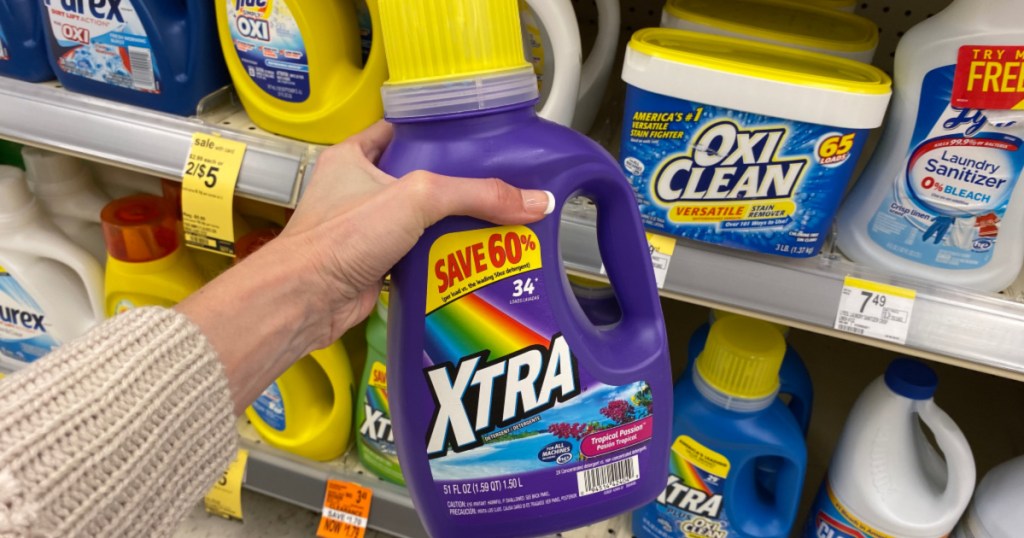 hand holding up bottle of xtra laundry detergent