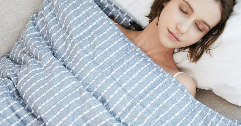 woman laying with blanket