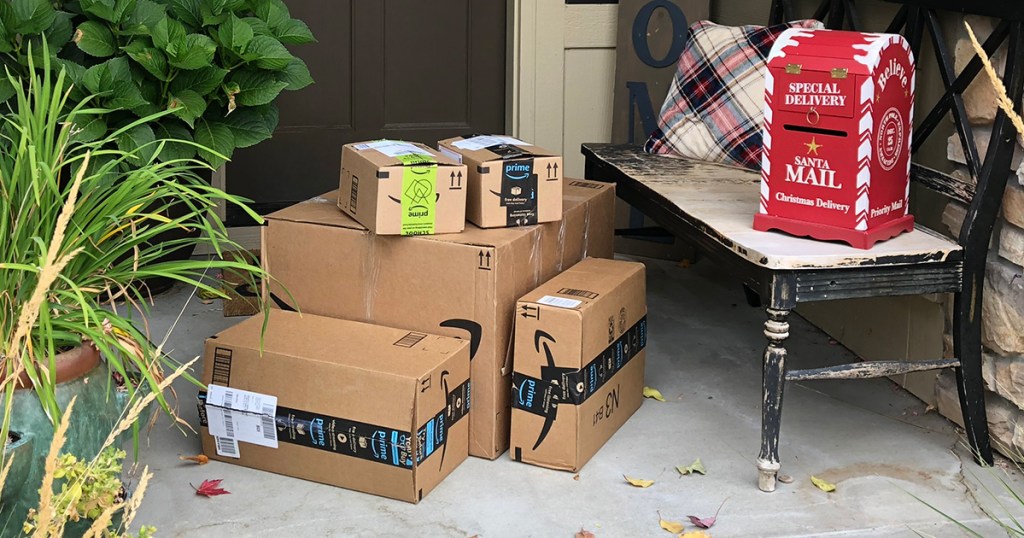 Amazon boxes on front porch with Christmas mail box