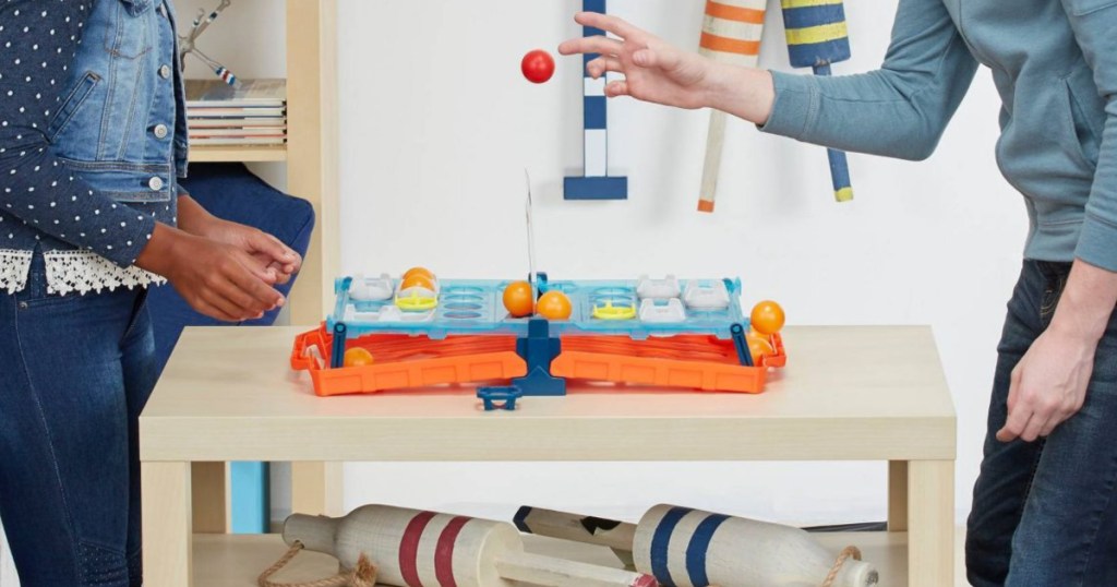 kids playing battleshots game