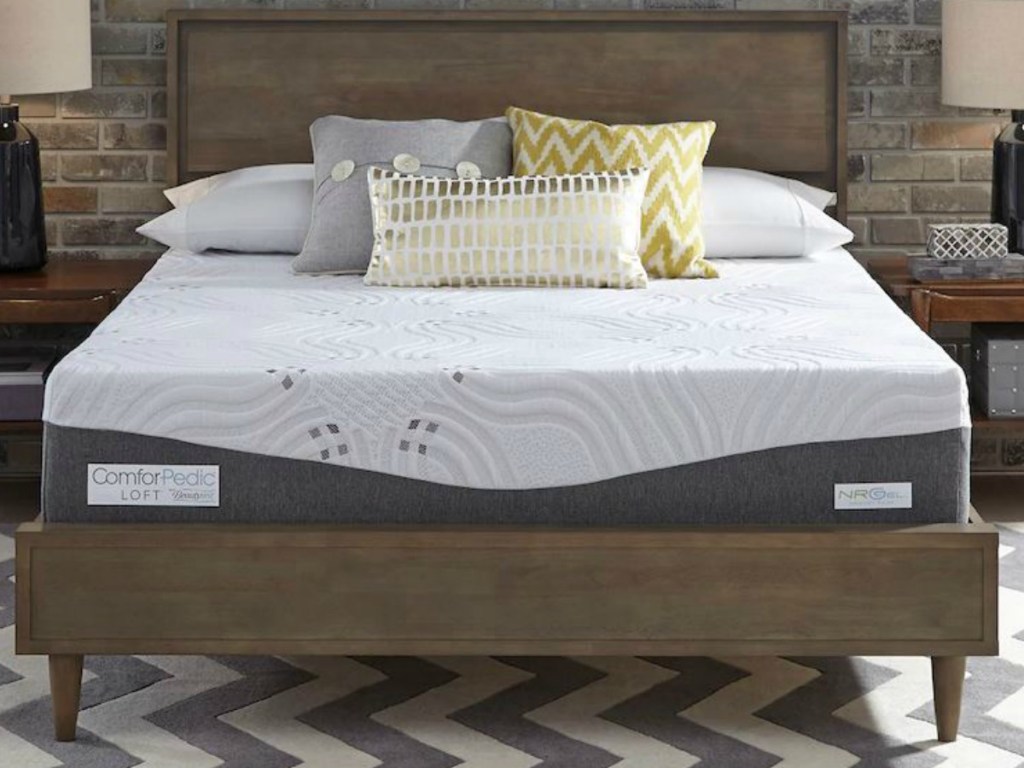 bed in frame with pillows on it