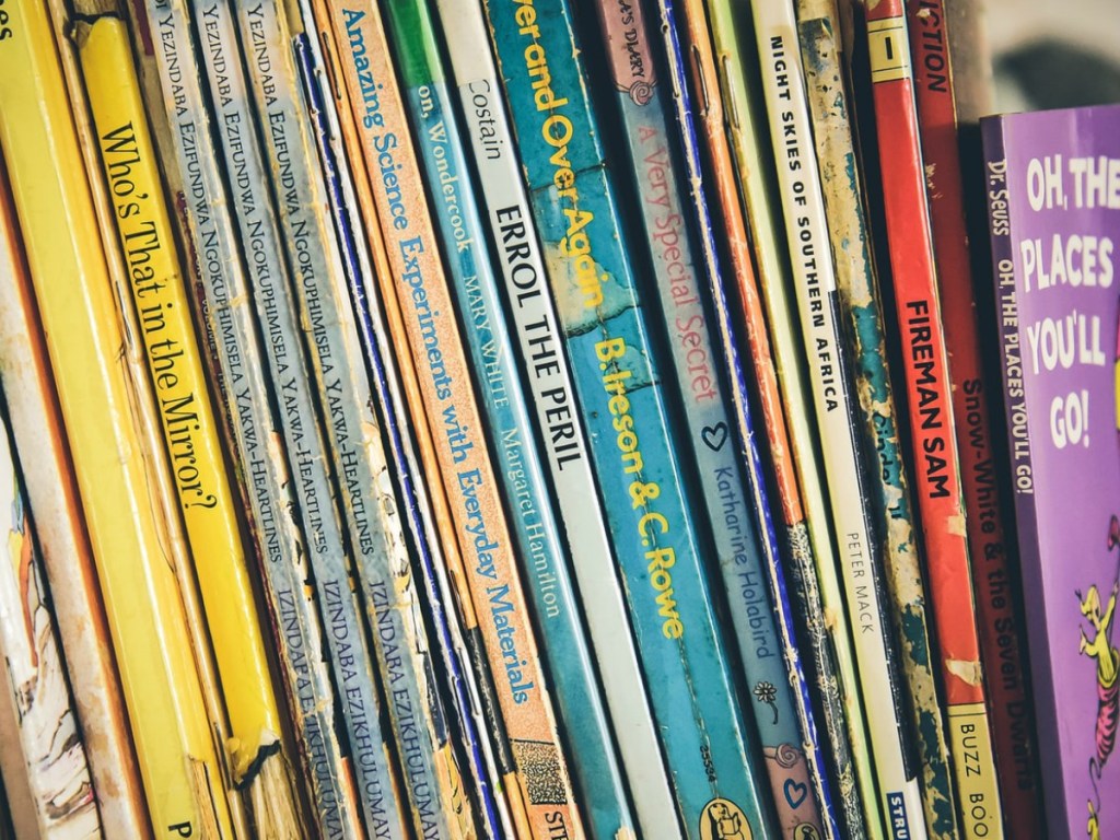 books stacked up on shelf