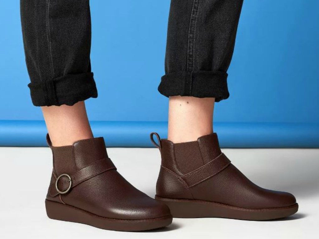 legs with short pants and brown shoes
