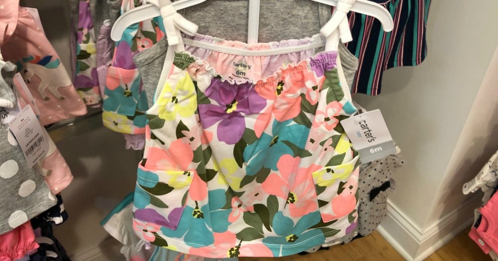 tank top with flowers on hanger in store