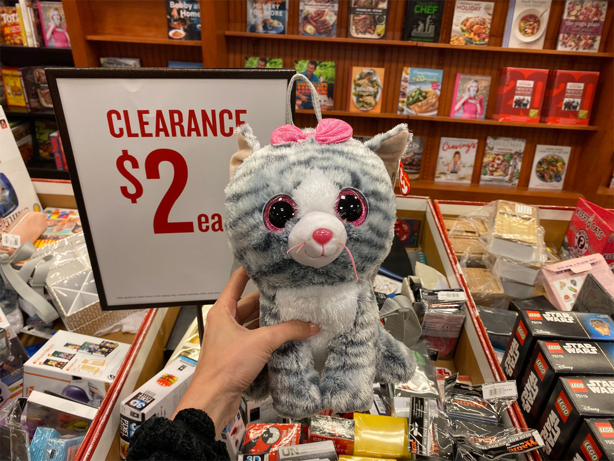 plush cat with pink bow on it's head