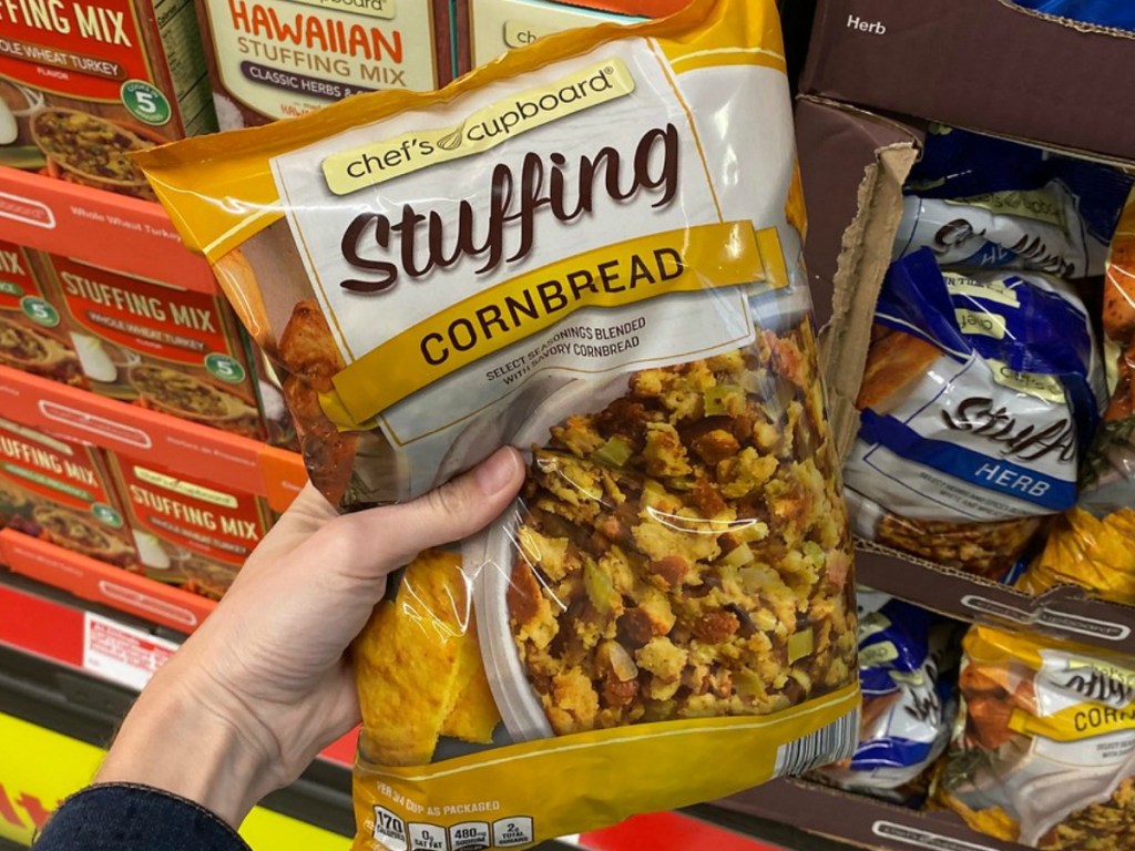 hand holding bag of stuffing by store display