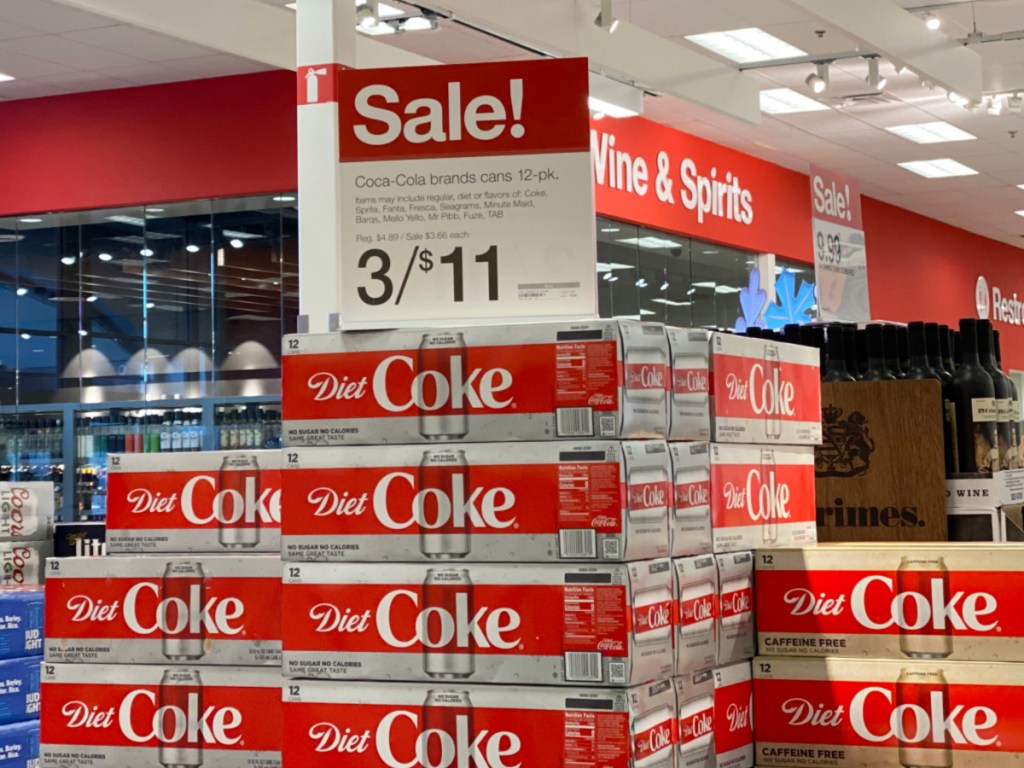 coca cola sale sign on top of diet coke display