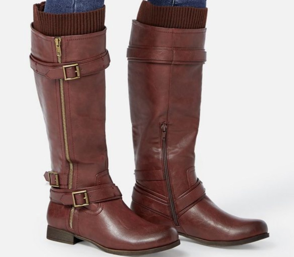 legs wearing brown boots