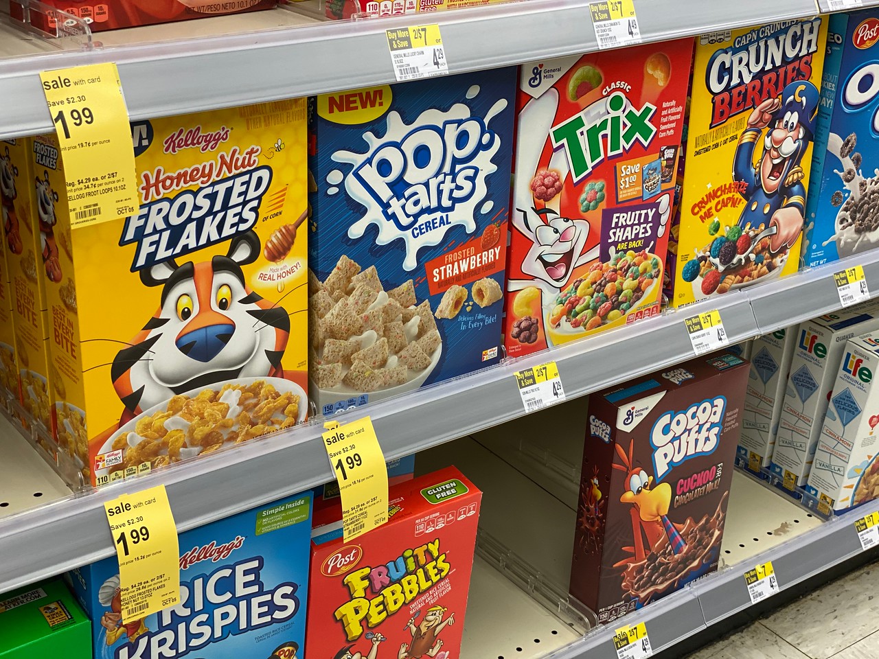 Kellogg's Cereals on Walgreens sehlf with sale tags