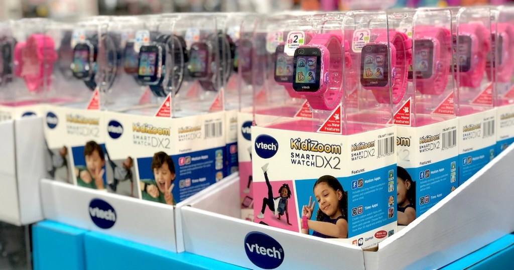 vtech kidizoom watches pink and black in boxes stacked on store shelf