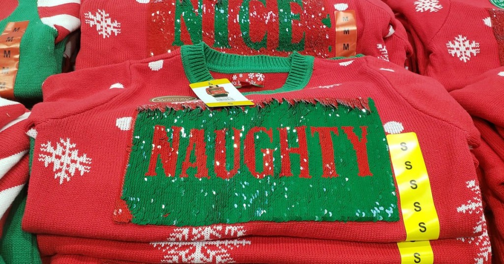 red sweater with work Naughty on it