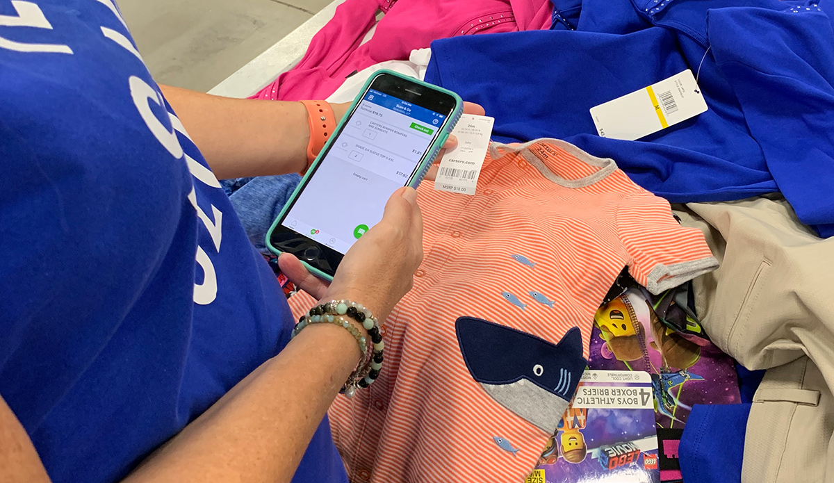 Paige using the Scan and Go app at Sam's Club