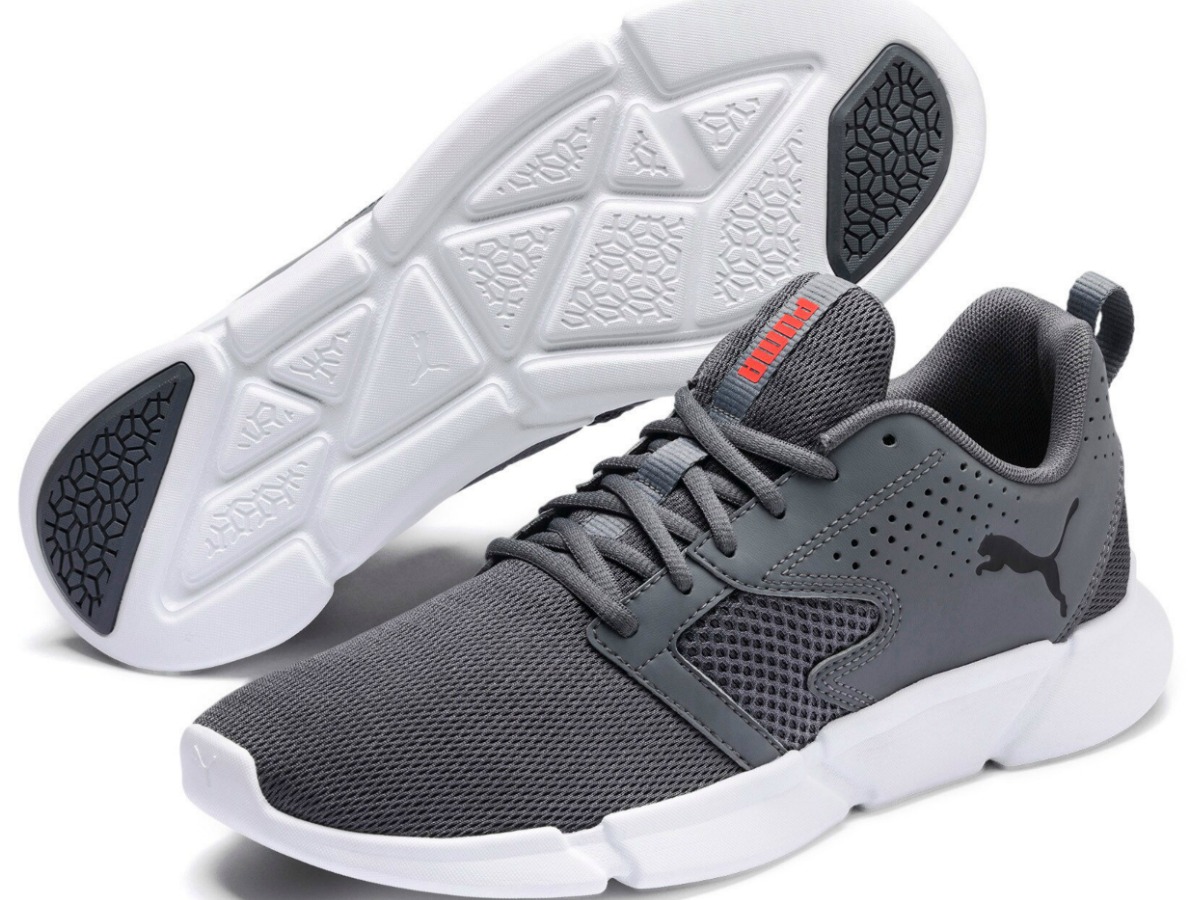 pair of grey shoes on white background