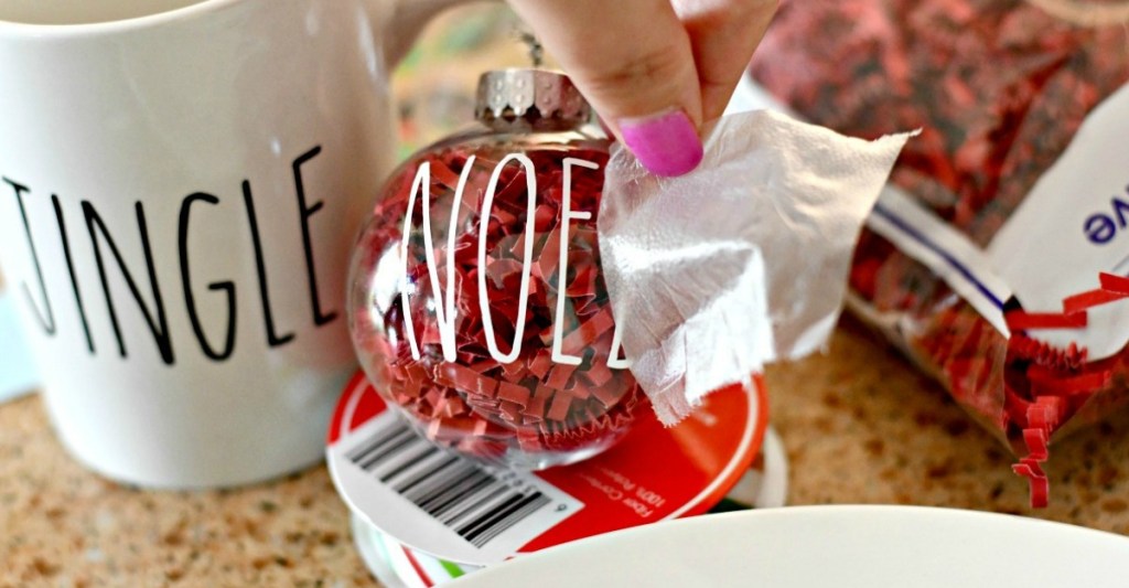 handmade ornament with person peeling off label