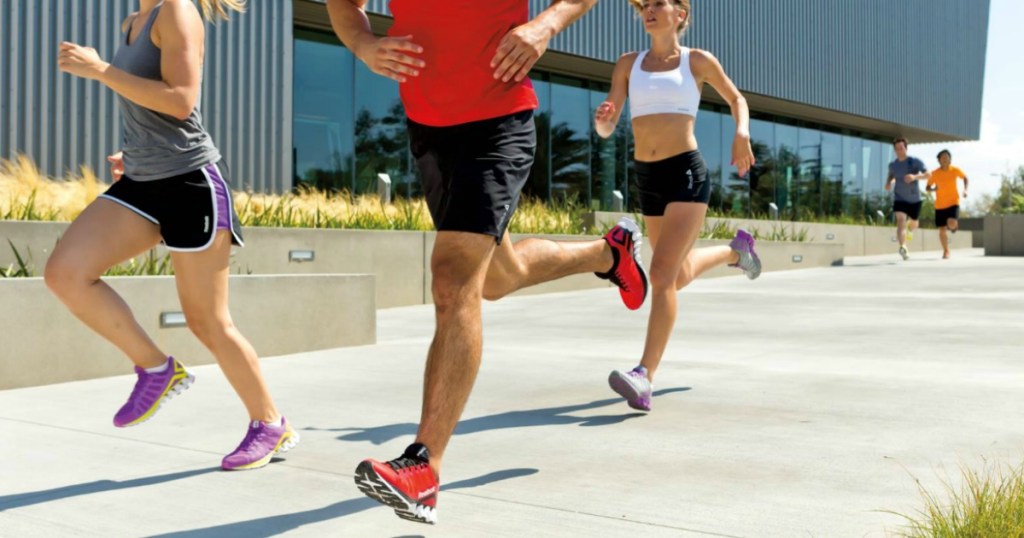 people running on sidewalk