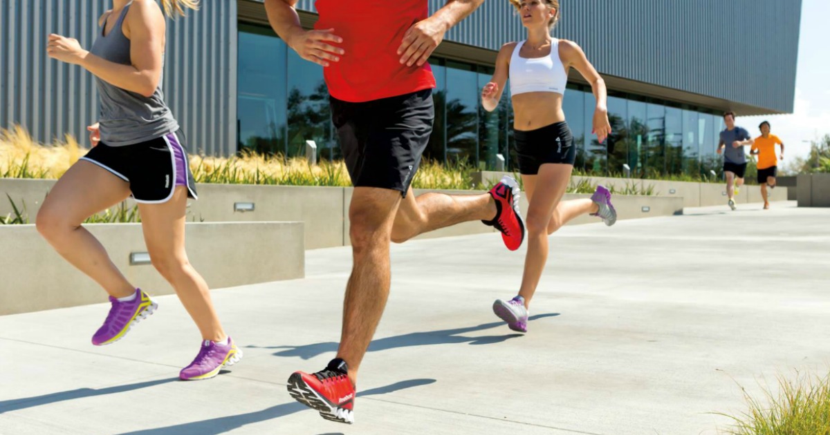 people running on sidewalk