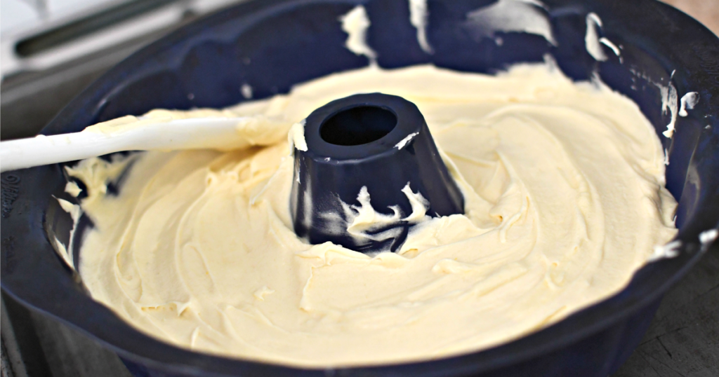 spreading batter into a bundt cake