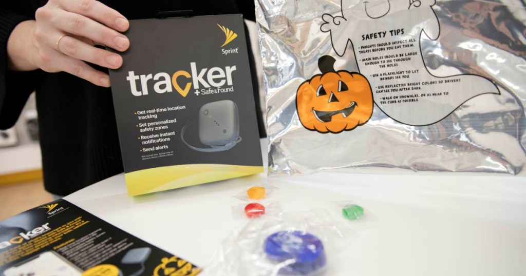 hand holding halloween supplies at table