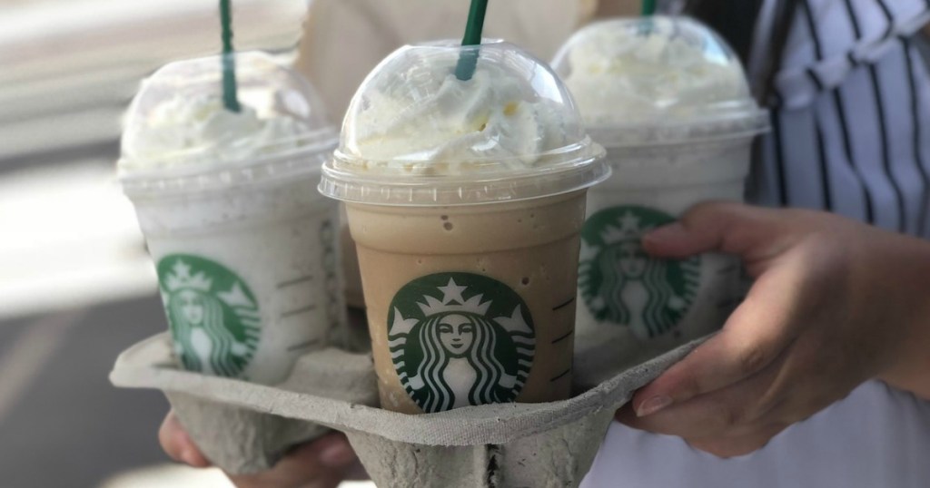 three starbucks drinks in drink holder