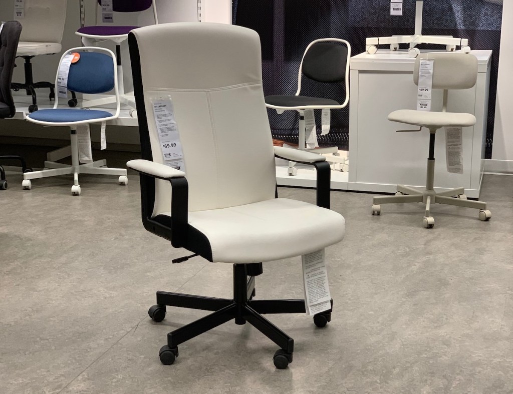 white and black swivel office chair sitting in IKEA store