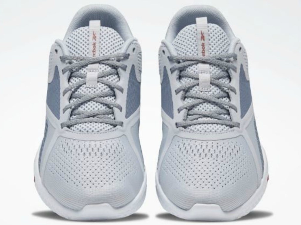 pair of grey shoes on white background