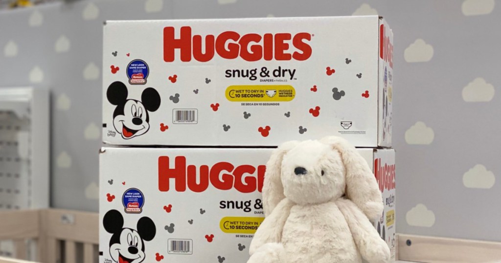 Huggies Snug & Dry Dry Diapers with stuffed animal leaning against diapers