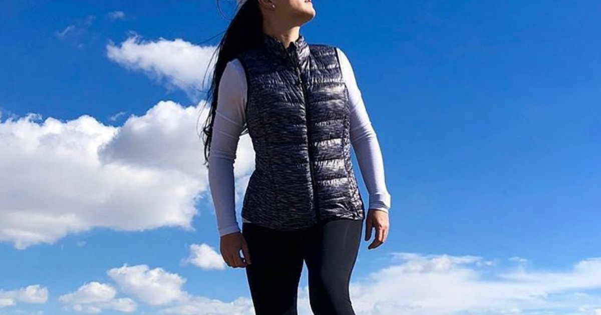 woman wearing puffer vest outside