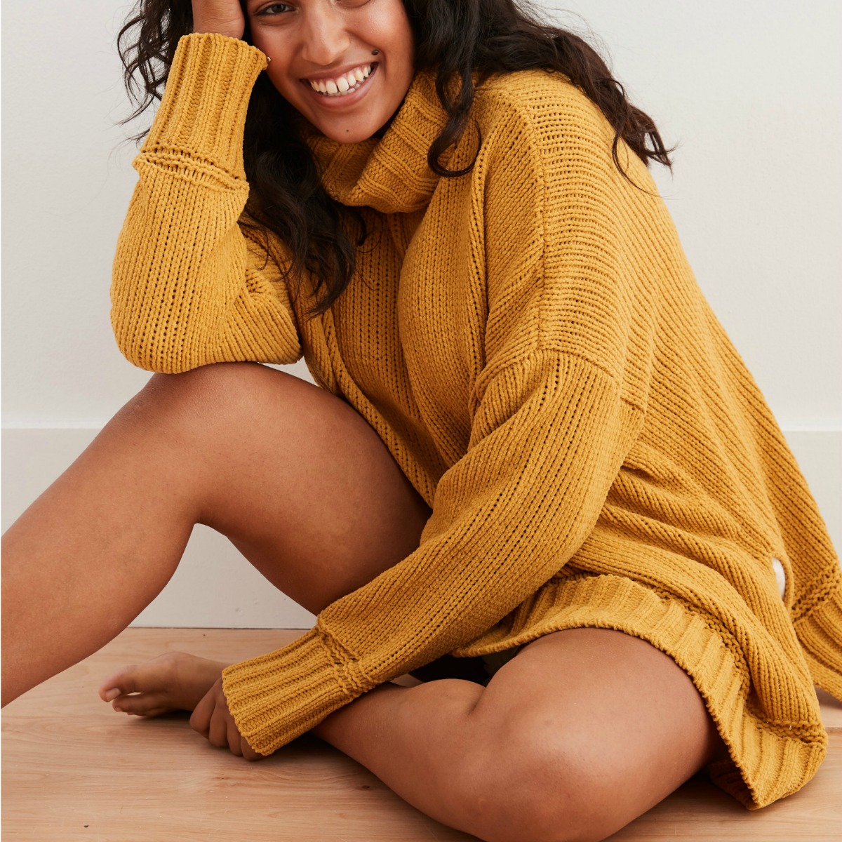 Woman wearing mustard colored chenille sweater