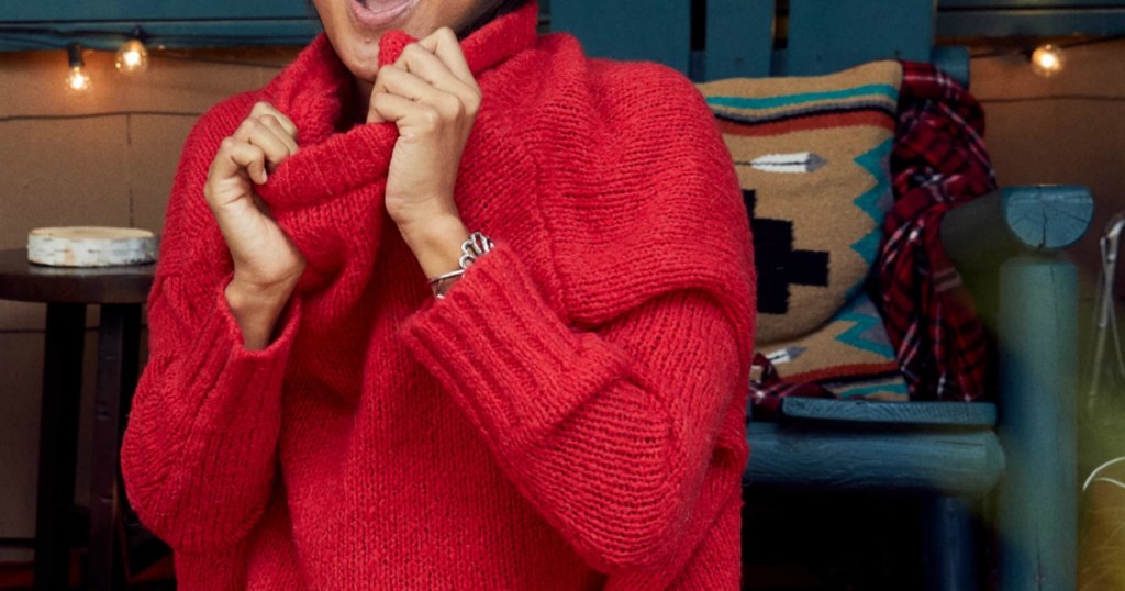 Woman wearing a red Aerie Over-sized chenille sweater