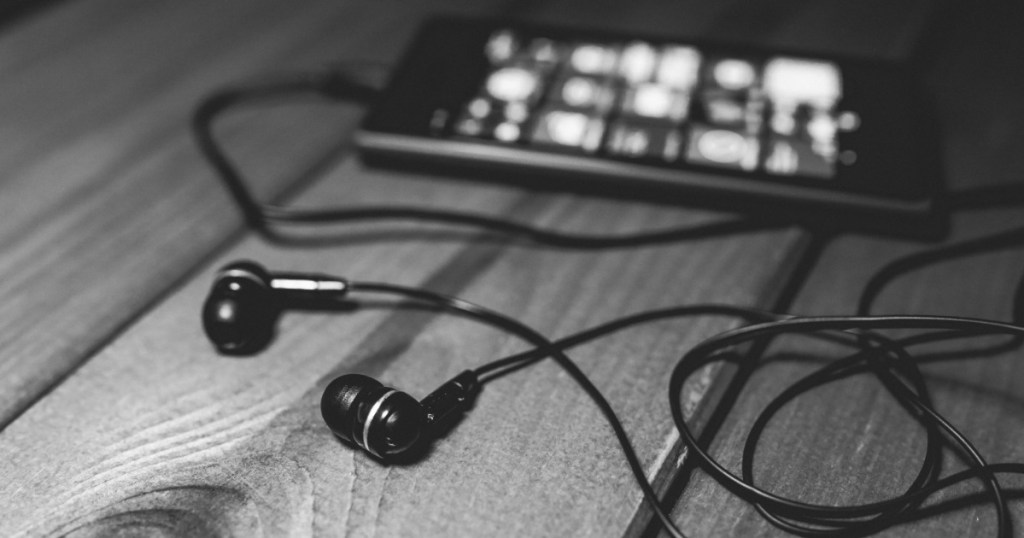 earbuds attached to a cell phone