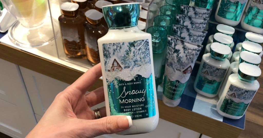 woman holding Bath & Body Works Body Lotion Winter in hand in store