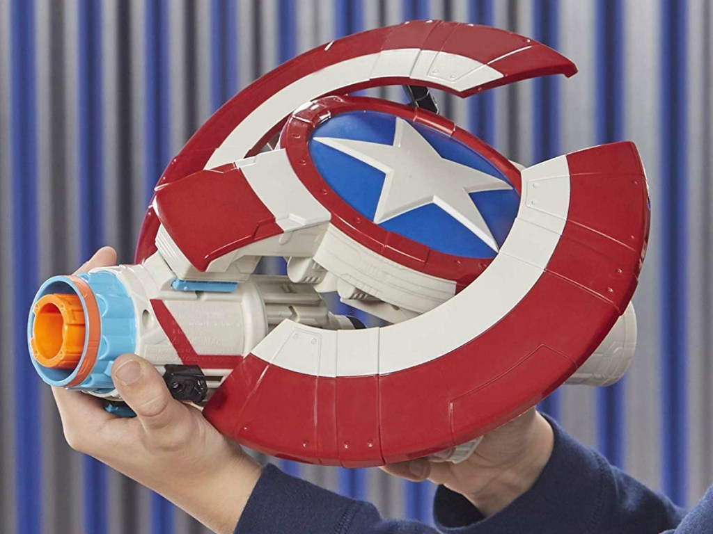Teen boy holding a Marvel themed NERF gun